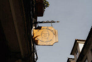 sign_hanging_outside_Mercearia_do_Pai_Júlio_Lisbon