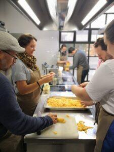 a_group_of_people_attending_an_Eating_Europe_cooking_class_in_Italy